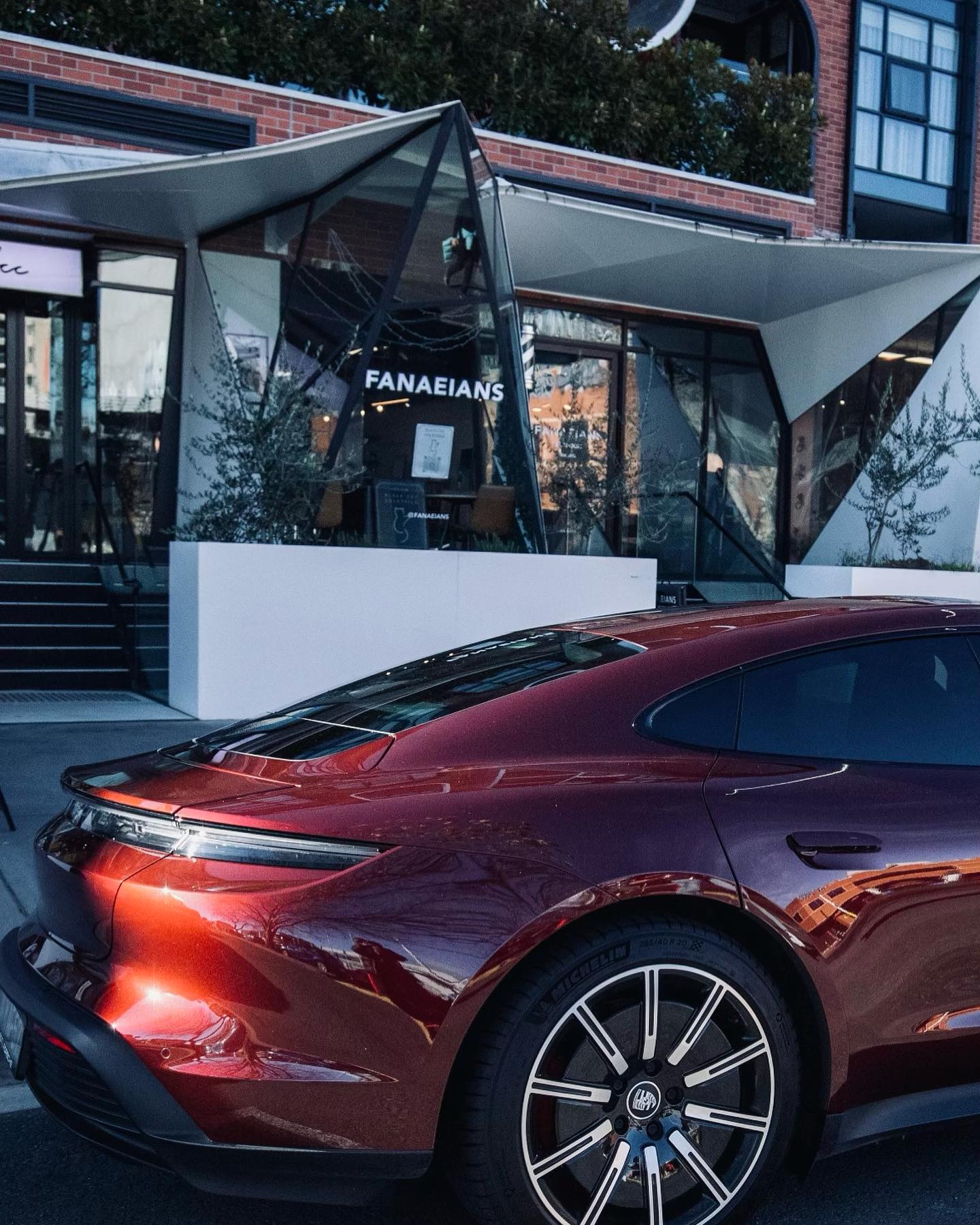 A luxury car outside the FANAEIANS salon